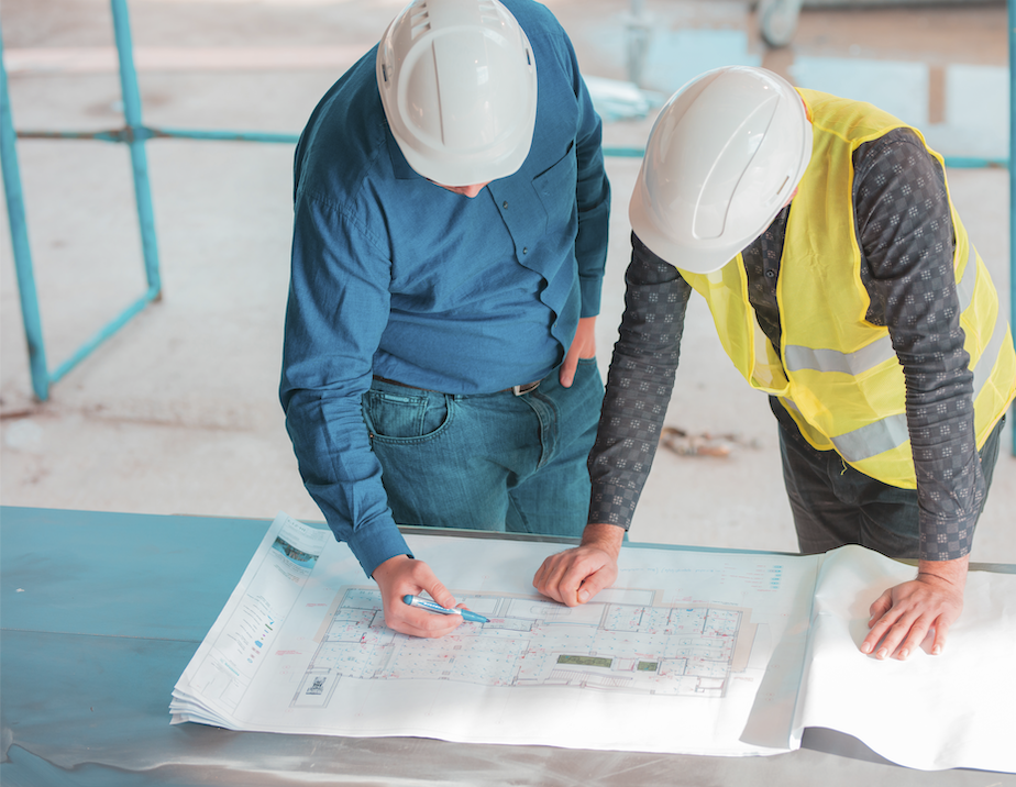 Offshore construction team reviewing project documentation
